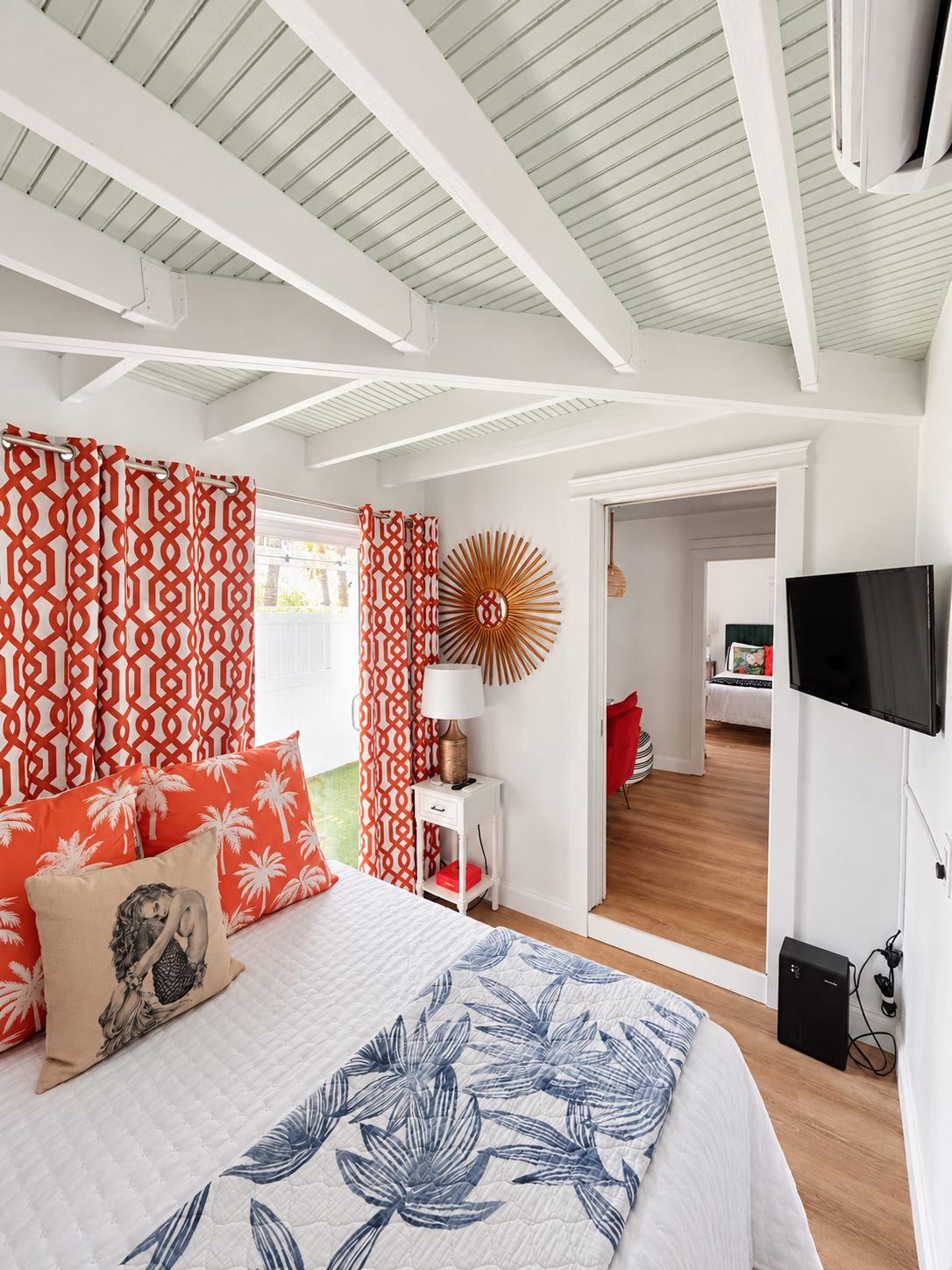 Second bedroom with coral curtains