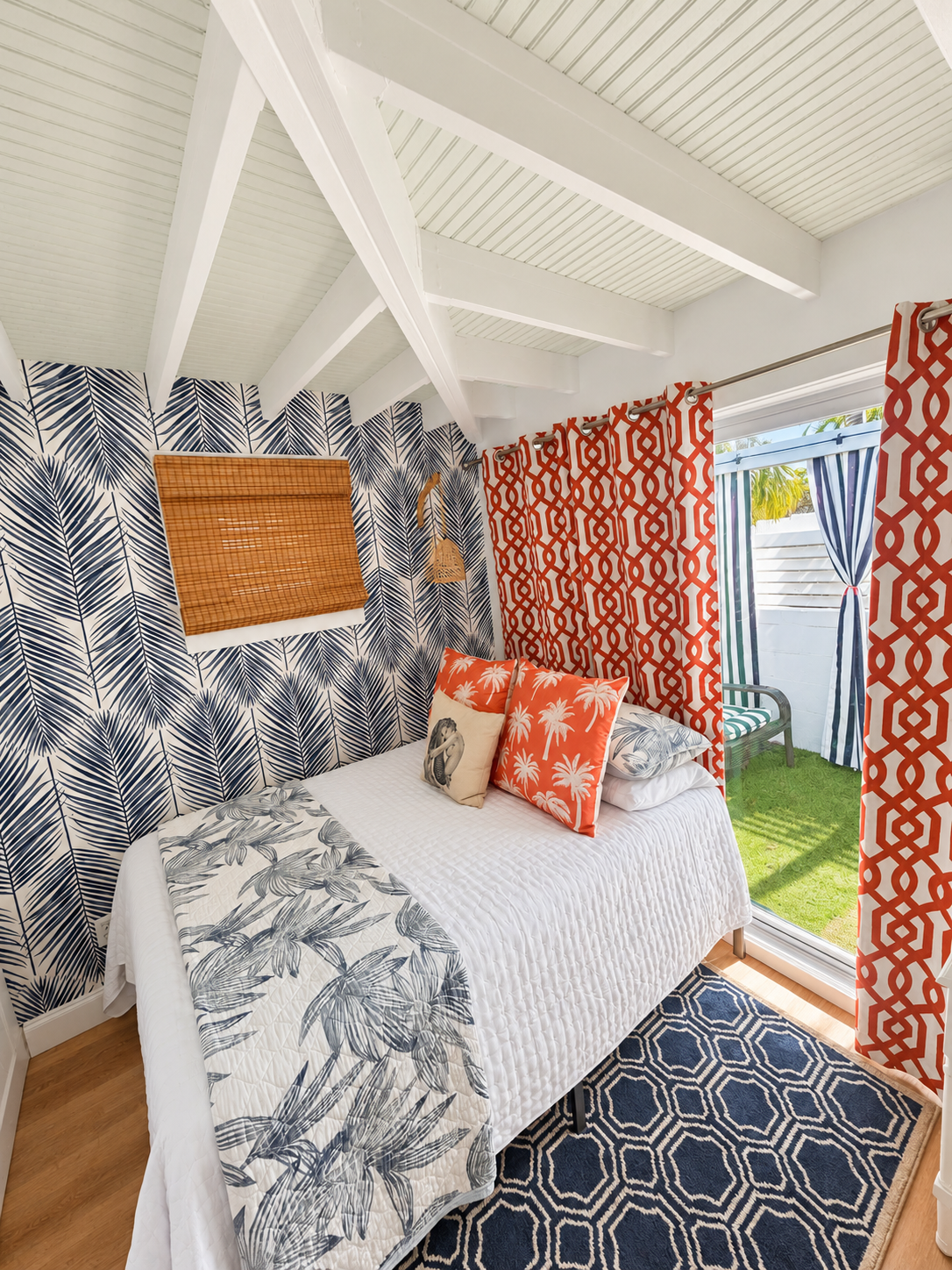 Second bedroom with blue palm wallpaper
