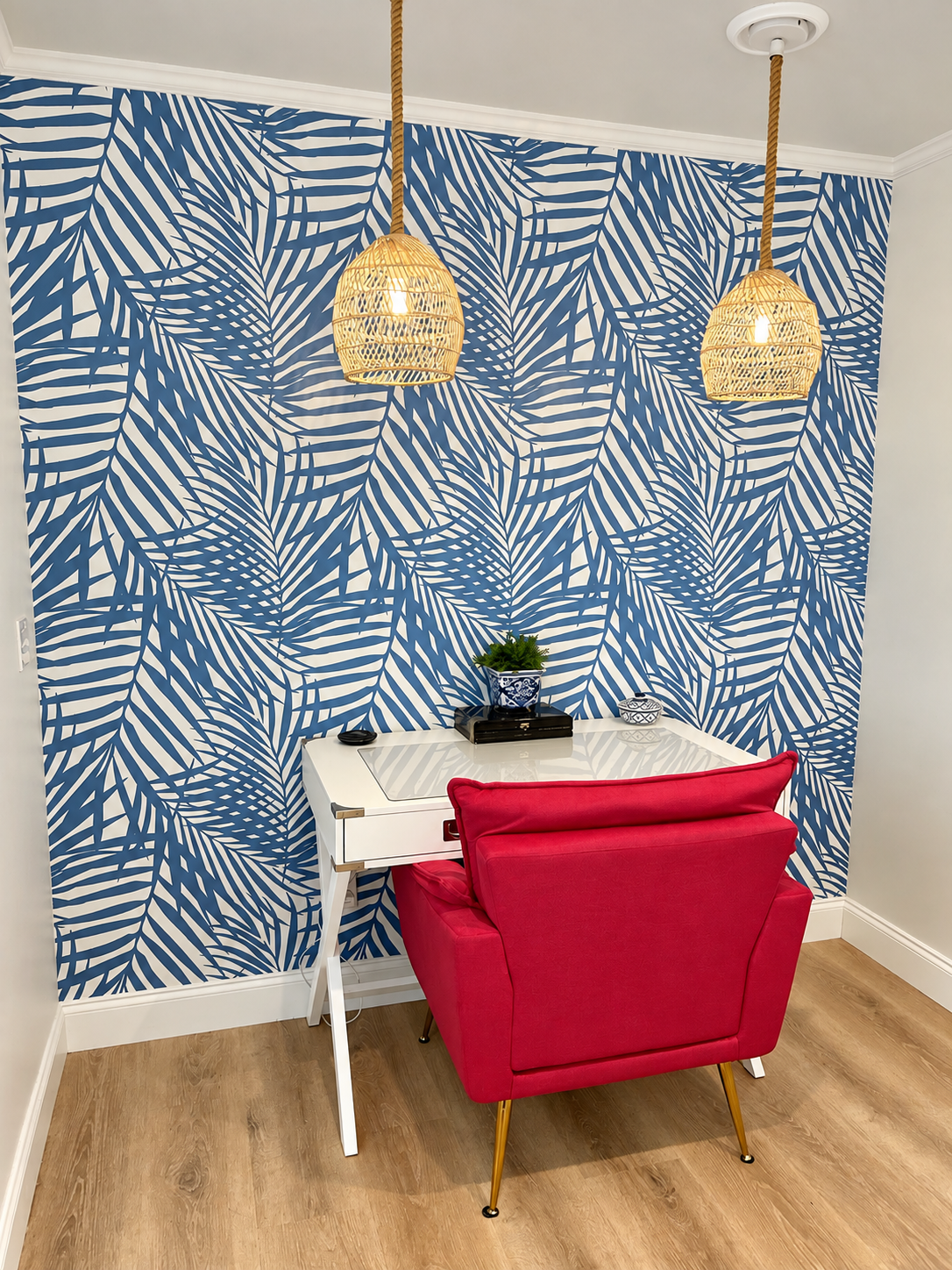 Office workspace with blue palm wallpaper
